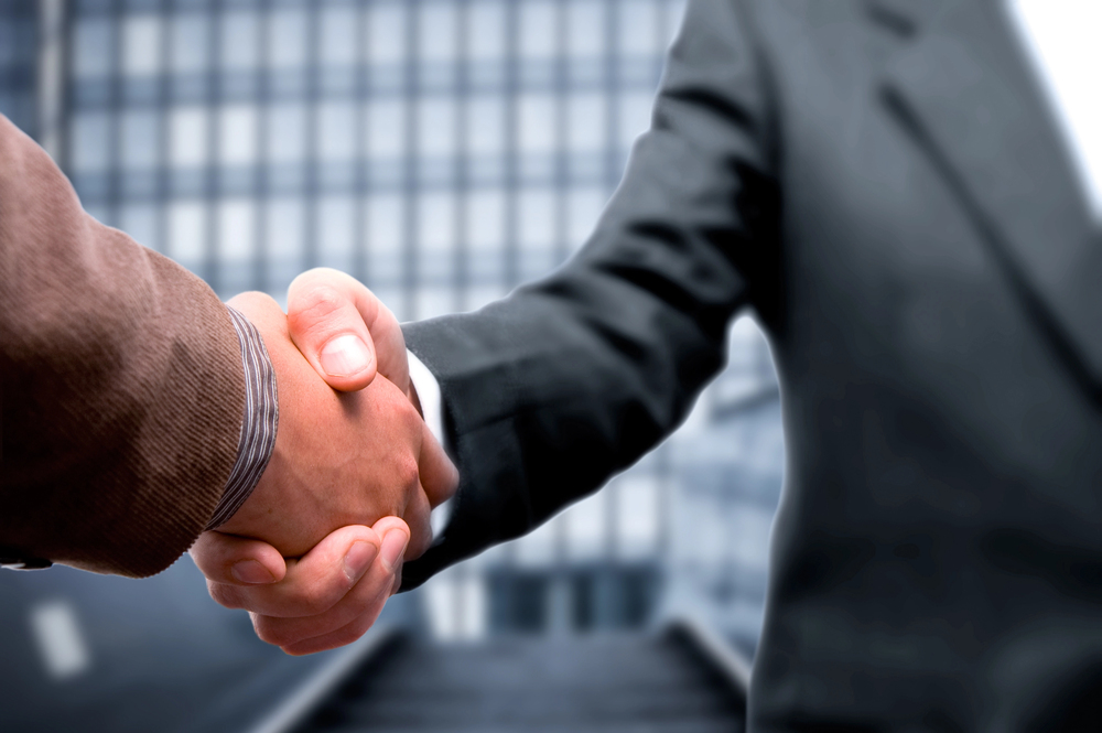 Compravendita attività o aziende - Stretta di mano